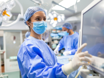 ACLS-certified professional confidently administering cardiac medication.